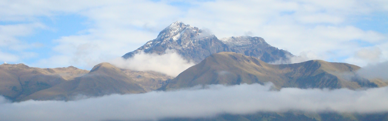 View of a mountain range from above the clouds.