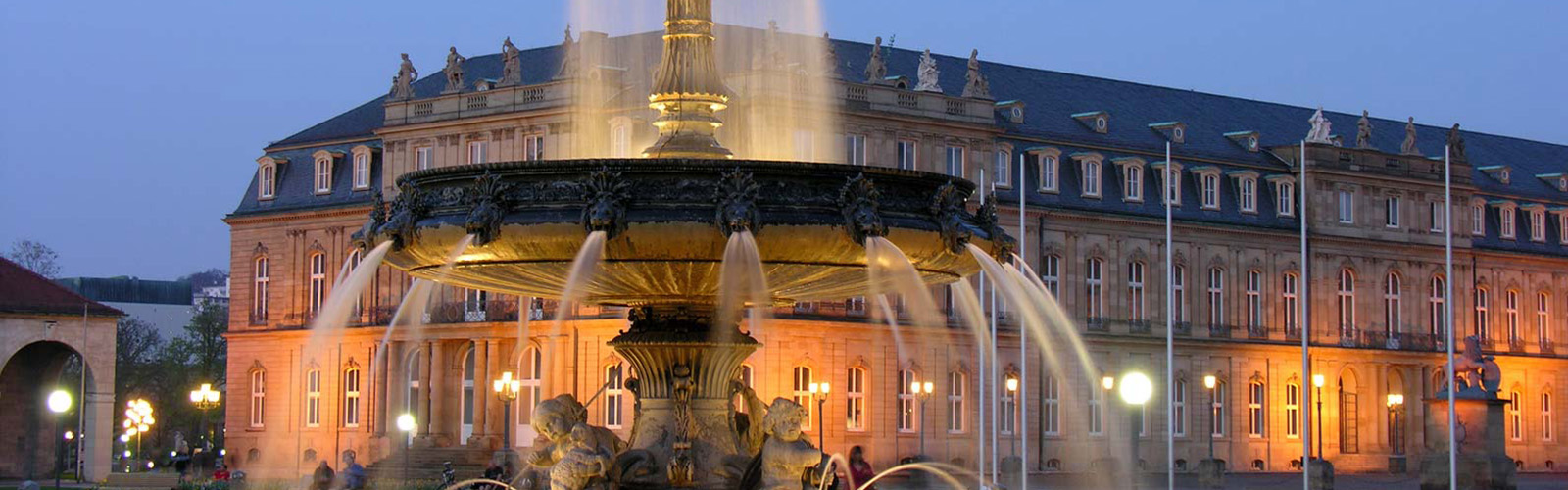 Large fountain in the city center. Water is coming from different angles of the fountain and has intricate detailing.