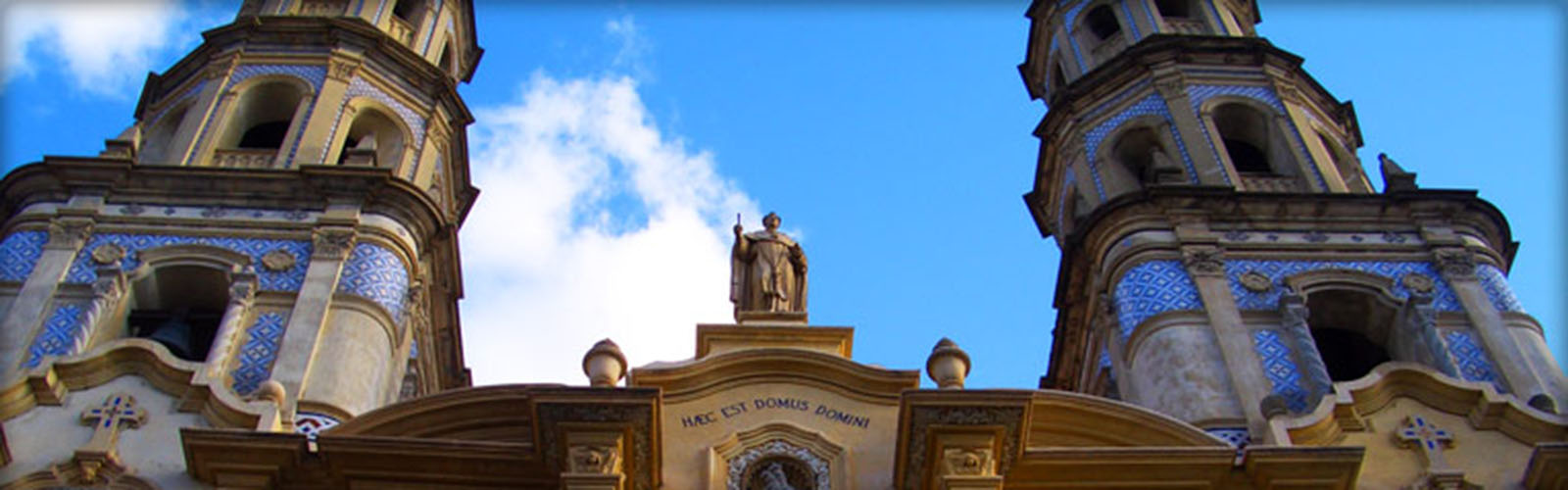 Large cathedral in Buenos Aires that has two symmetrical spires on either side. The cathedral has ornate decoration.